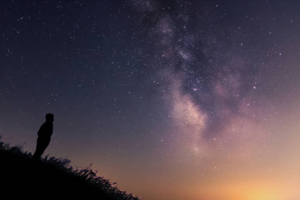 istock Lonely man gazing at the Milky Way 867463384