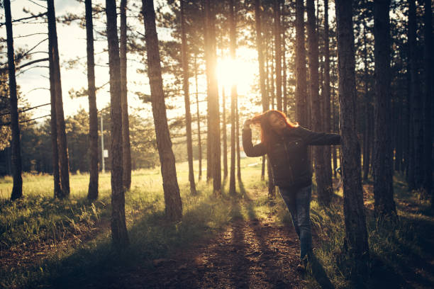 istock Woman in forest at suset 867466252