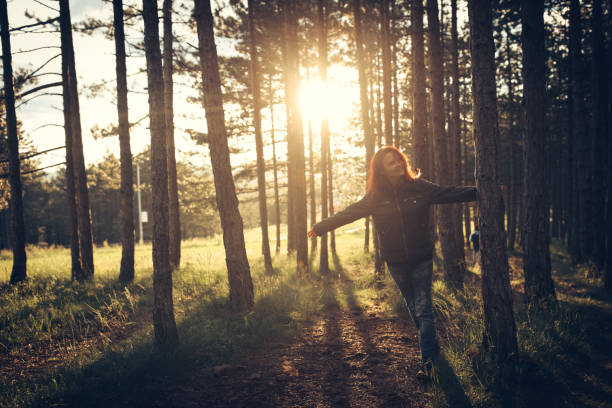 istock Woman in forest at suset 867467006