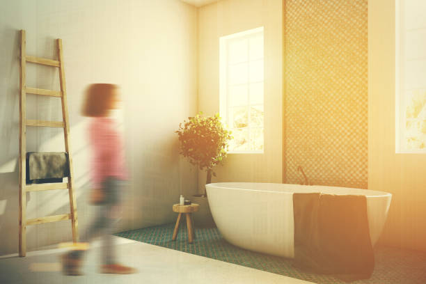 istock Blue and white bathroom, white tub corner, girl 867467974