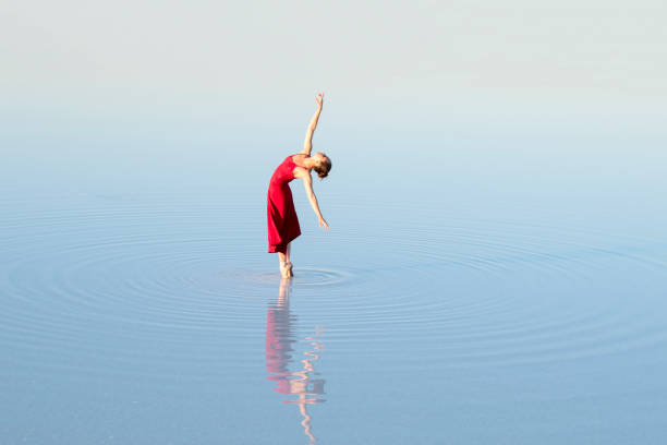 istock young ballet dancing on the lake in the evening 867480288