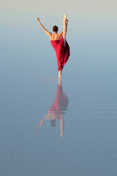 istock young ballet dancing on the lake in the evening 867480300