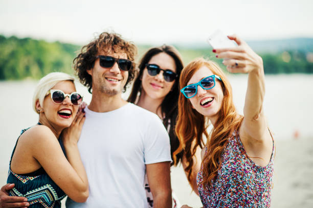 istock International students enjoying weekend on the local beach 867487058