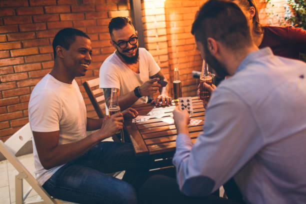 istock Male friends having fun in back yard 867488374