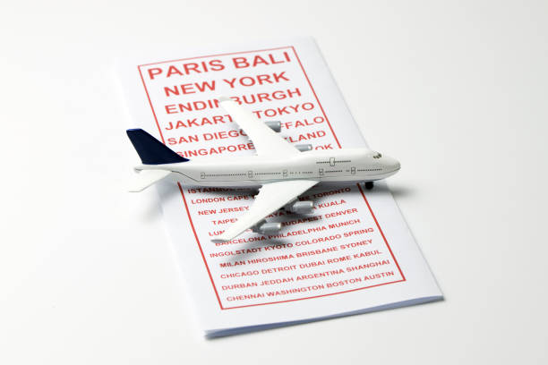 istock Travel brochure with a model airplane 867491632
