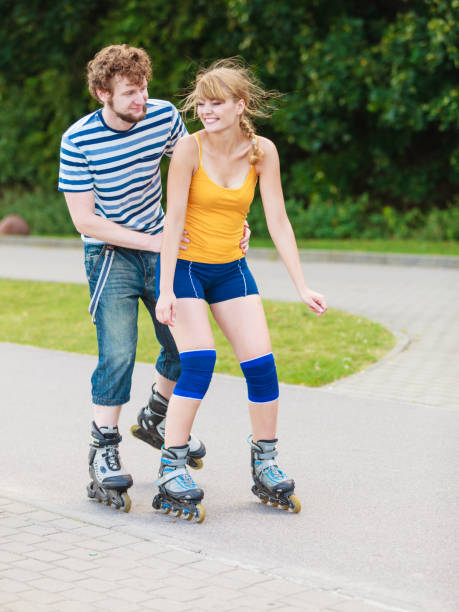 istock Young couple on roller skates riding outdoors 867502214