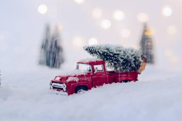 istock Toy pickup car carrying Christmas tree 867503048
