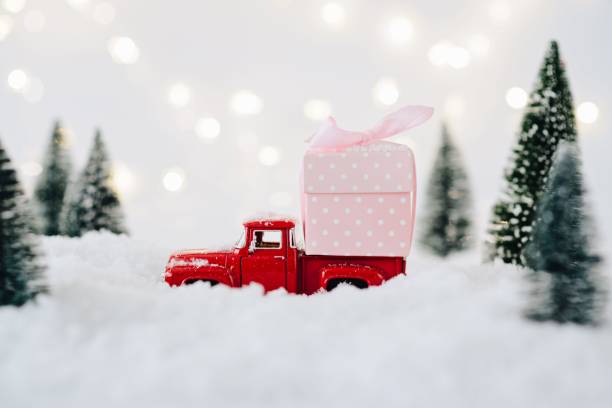 istock Toy pickup car carrying Christmas present 867503084