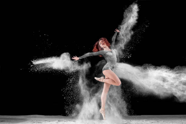 istock Beautiful ballet dancer, dancing with powder on stage 867503468