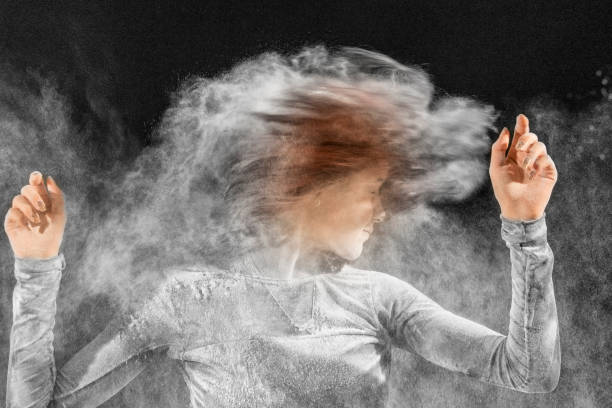 istock Beautiful ballet dancer, dancing with powder on stage 867503482