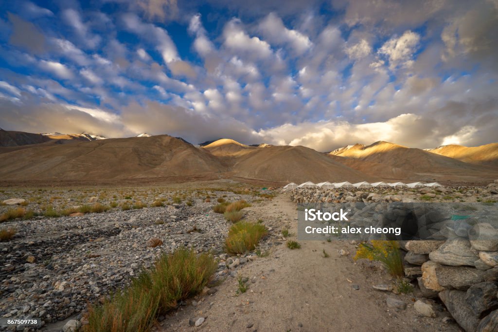 Pangong Tso Mountain dramatic cloud flying from mountain of Pangong lake Asia Stock Photo