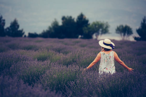 istock Senior woman in fields of lavander 867509794