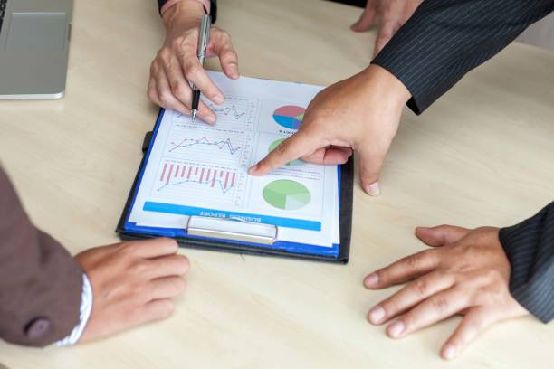 istock Business concept. Business people discussing the charts and graphs. 867520018