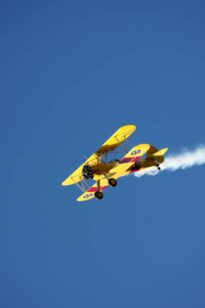 istock yellow aeroplane on sky 867521660