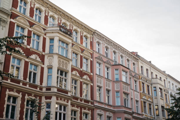 istock red, pink row houses with detailed white pieces 867522896