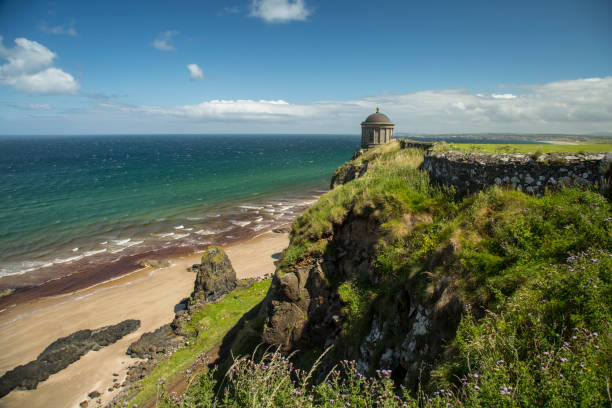 mussenden temple north ireland Northern Ireland - Aug 01, 2017: Mussenden Temple a popular tourist attraction on the Atlantic Ocean coast of Northern Ireland. Castle Rock stock pictures, royalty-free photos & images