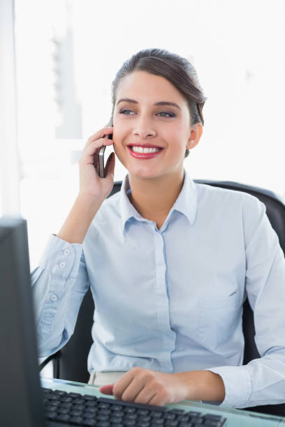 istock Content classy brown haired businesswoman making a phone call 867538198