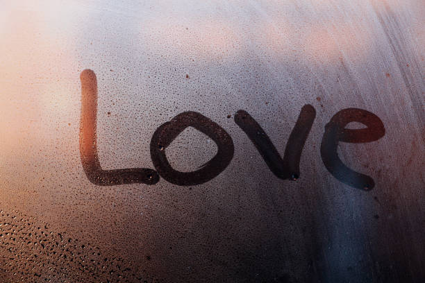istock Word love written on window glass 867541542