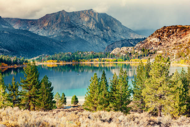 June Lake on a fall morning, one of three main lakes on the June Lake Loop off Highway 395 in the Owens Valley of California. Carson Peak 10,909ft looms over the lake.