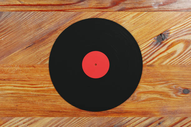 istock Vinyl record on wooden background 867551368