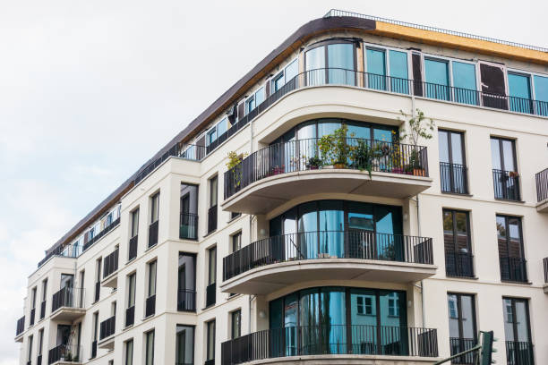 istock white facaded modern building with curved balcony 867553788
