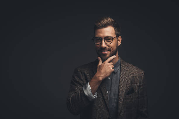 istock Smiling man with hand on chin 867556714