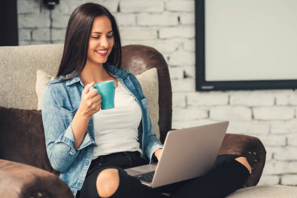 istock Woman using a laptop at home 867556922