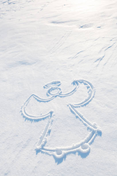 A winter snow angel on winter snow background.