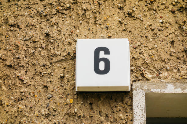 istock number 6 door sign on brown wall 867557394