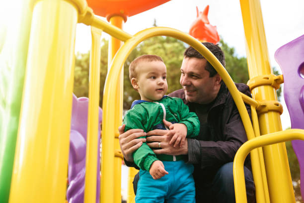 istock Father and son enjoying an outdoor playground 867558022