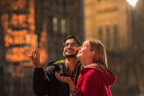 istock Young couple enjoying in the rain 867560408