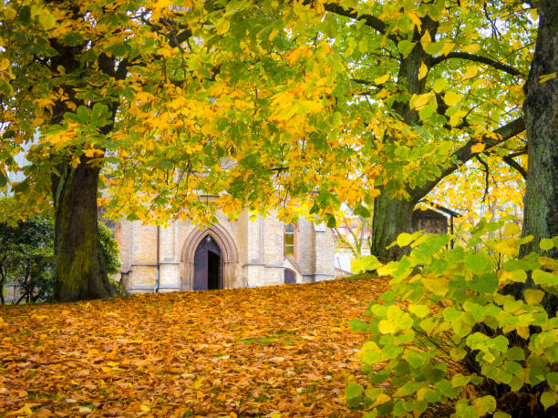 istock Church in autumn from away 867563338