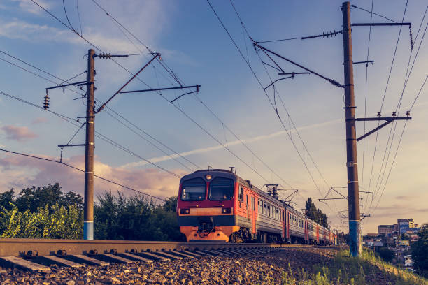 istock Modern passenger train on the background of blue and purple sky 867565880