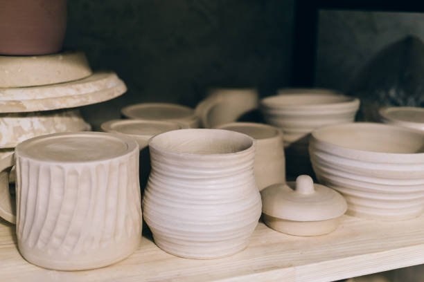 istock Handcrafted pottery on wooden shelf 867566590