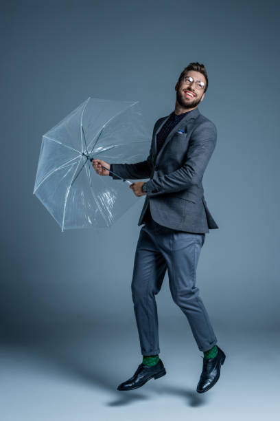 istock Man in suit with umbrella 867567086