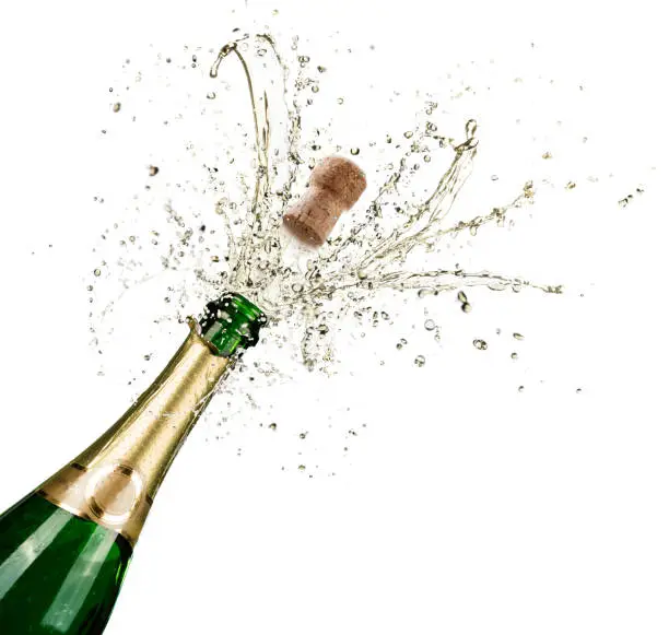 Bottle With Champagne Explosion On White