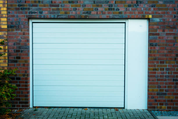 istock white garage door with brick facade 867575160
