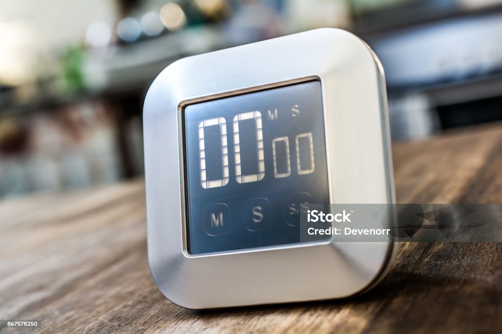 0 Minutes - Digital Chrome Kitchen Timer On Wooden Table Alarm Stock Photo