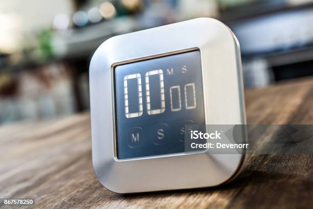 0 Minutes Digital Chrome Kitchen Timer On Wooden Table Stock Photo - Download Image Now