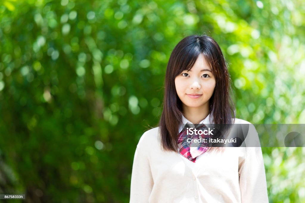 portrait of asian school girl in park High School Student Stock Photo