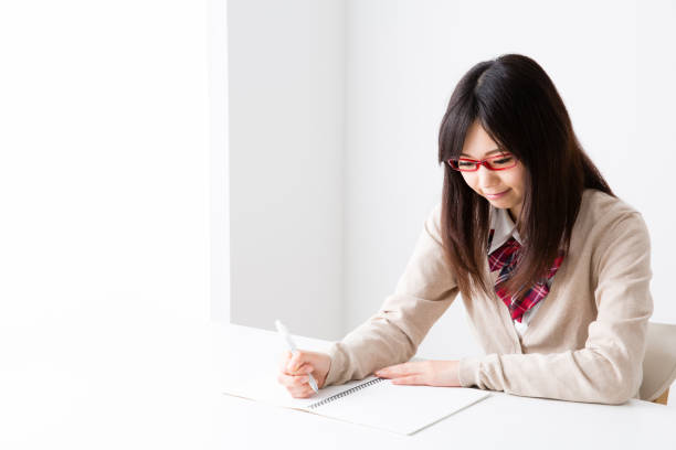 asian school girl studying in room