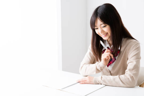 asian school girl studying in room