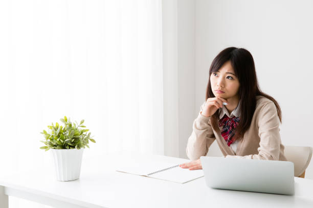 istock asian school girl studying in room 867583474