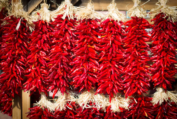 istock Santa Fe, New Mexico: Sunlit Chili Pepper Ristras Hanging 867589060