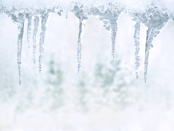 istock Winter's Tale: icicles on a background of snow-covered forest 867598786