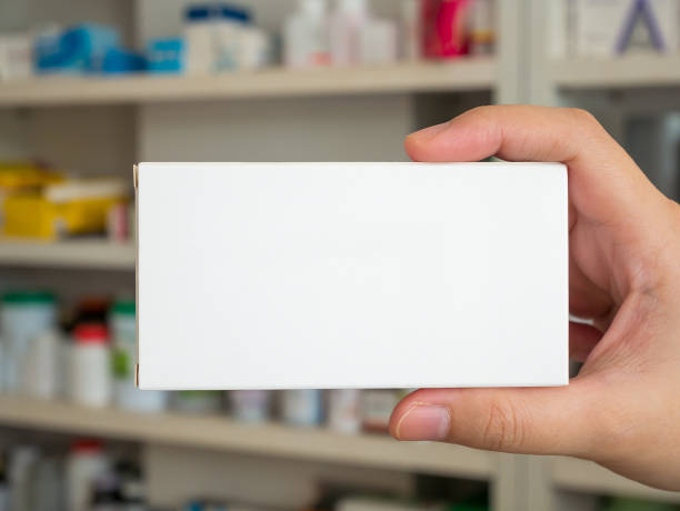 istock Close up pharmacist hand hold medicine box package 867612366