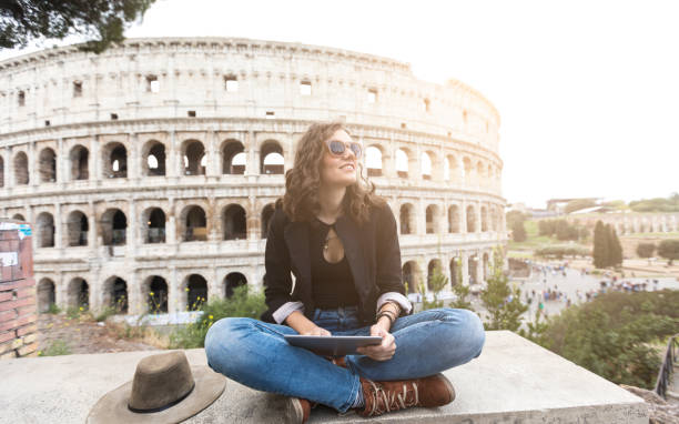 istock Woman sitting legs crossed and using tablet 867612530
