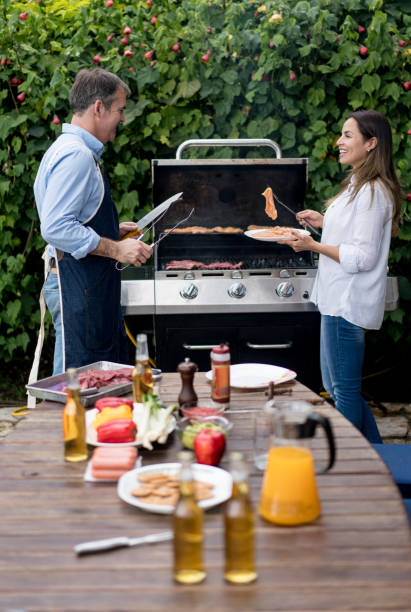 istock Happy couple cooking at a barbecue 867612766