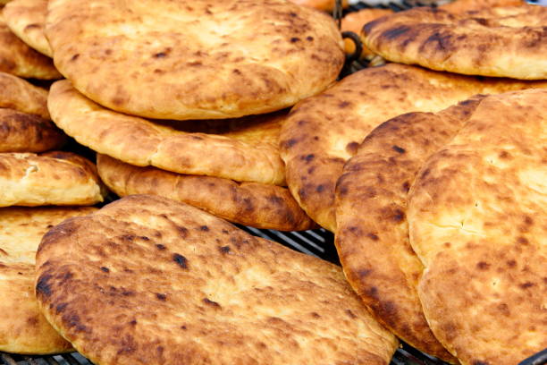 istock Hot and fresh baked flatbread on a frill for a picnic 867612922