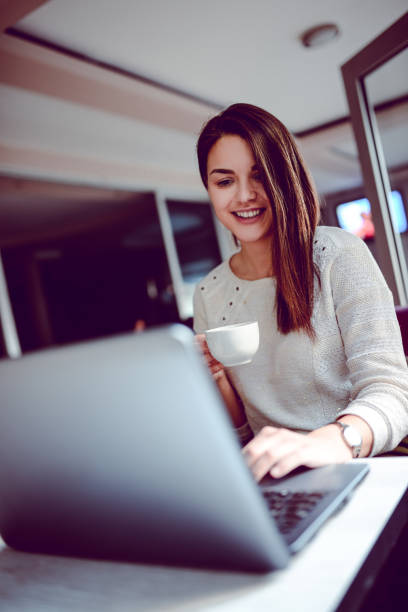 istock Young Cheerful Female Working on Computer at Home 867631972